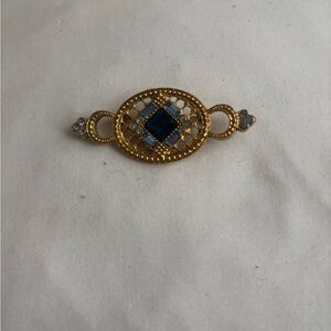 Elegant Gold and Blue Brooch